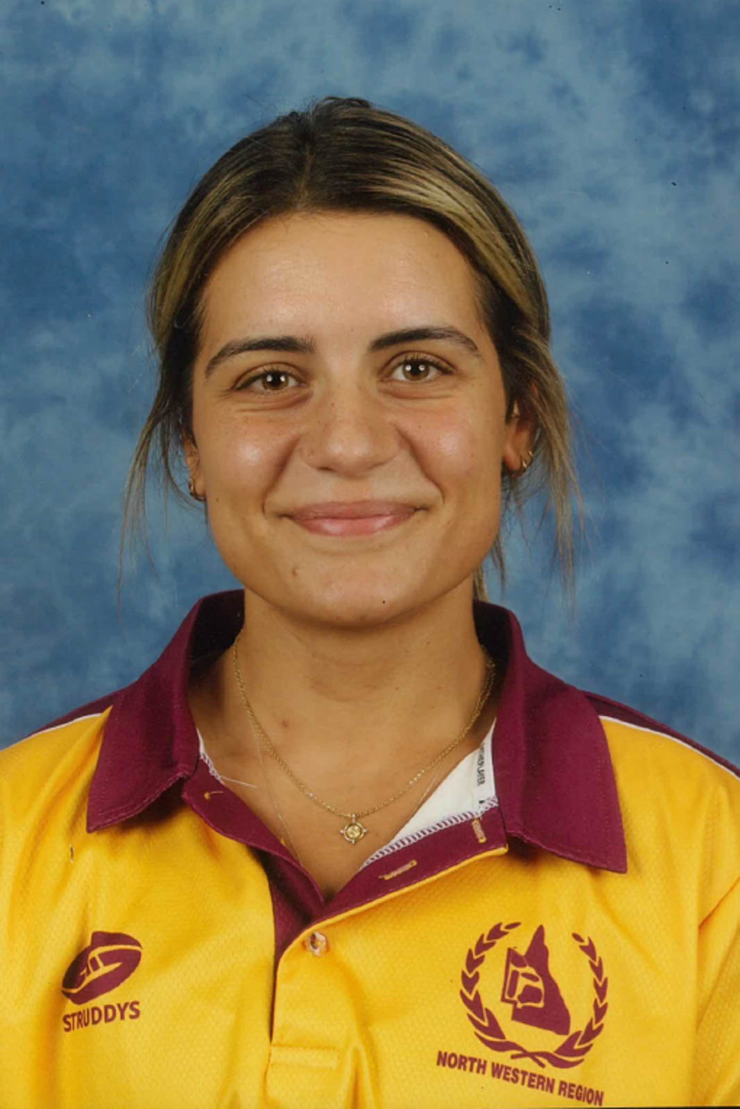 Headshot of Teresa in a yellow and maroon polo.