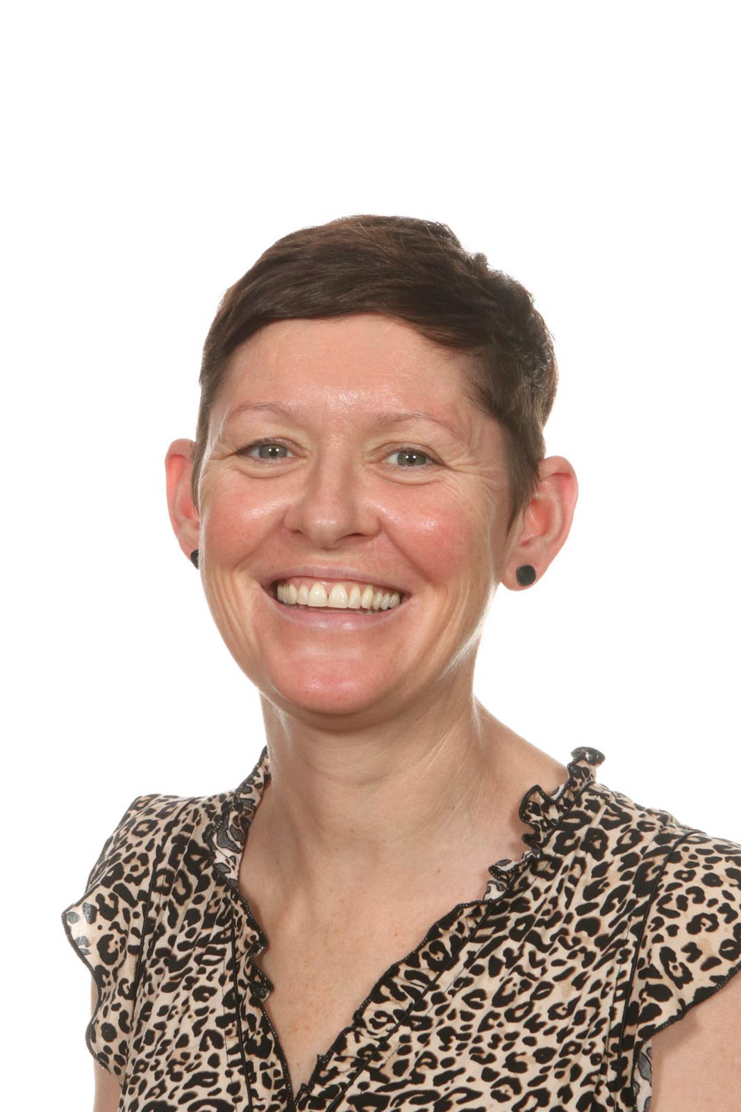 Headshot of Laura in a leopard-patterned blouse. 