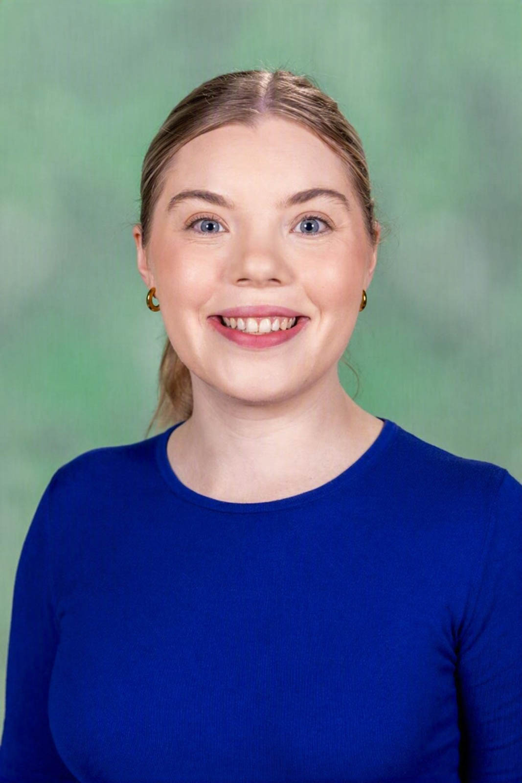 Headshot of Calista in a blue top.